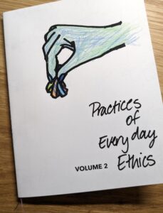 Cover of "Practices of Everyday Ethics Vol 2 Meditations on Textile Waste" by Lois Klasen. The image on the cover is a drawing of a hand holding a small bunch of textile waste. The image has been coloured with pencil crayons, with the hand coloured blue and green.