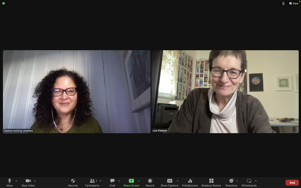 The image is a screen capture from a zoom meeting with Deanne Achong seen in a window on the left and Lois Klassen seen in a window on the right. Both are smiling and both have glasses. Deanne has curly black hair, worn loose, and brown skin. Lois has very short brown hair and light coloured skin.