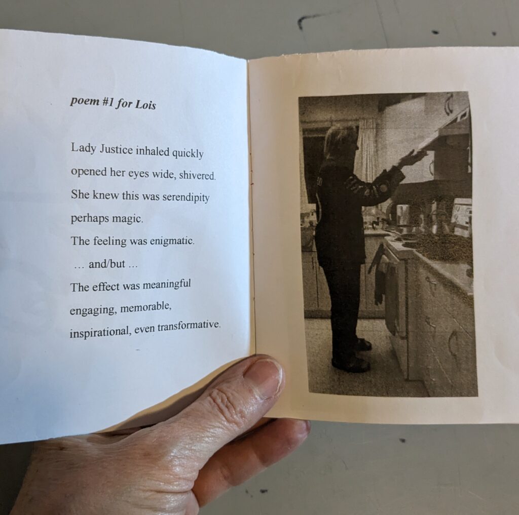 The inside of the 'zine "Lady Justice" is shown with a poem on the left and a black and white photo of Margaret Dragu holding the Sword of Justice in her hands on the right. Dragu is standing with both hands raised (holding the sword), in front of her stove. 
