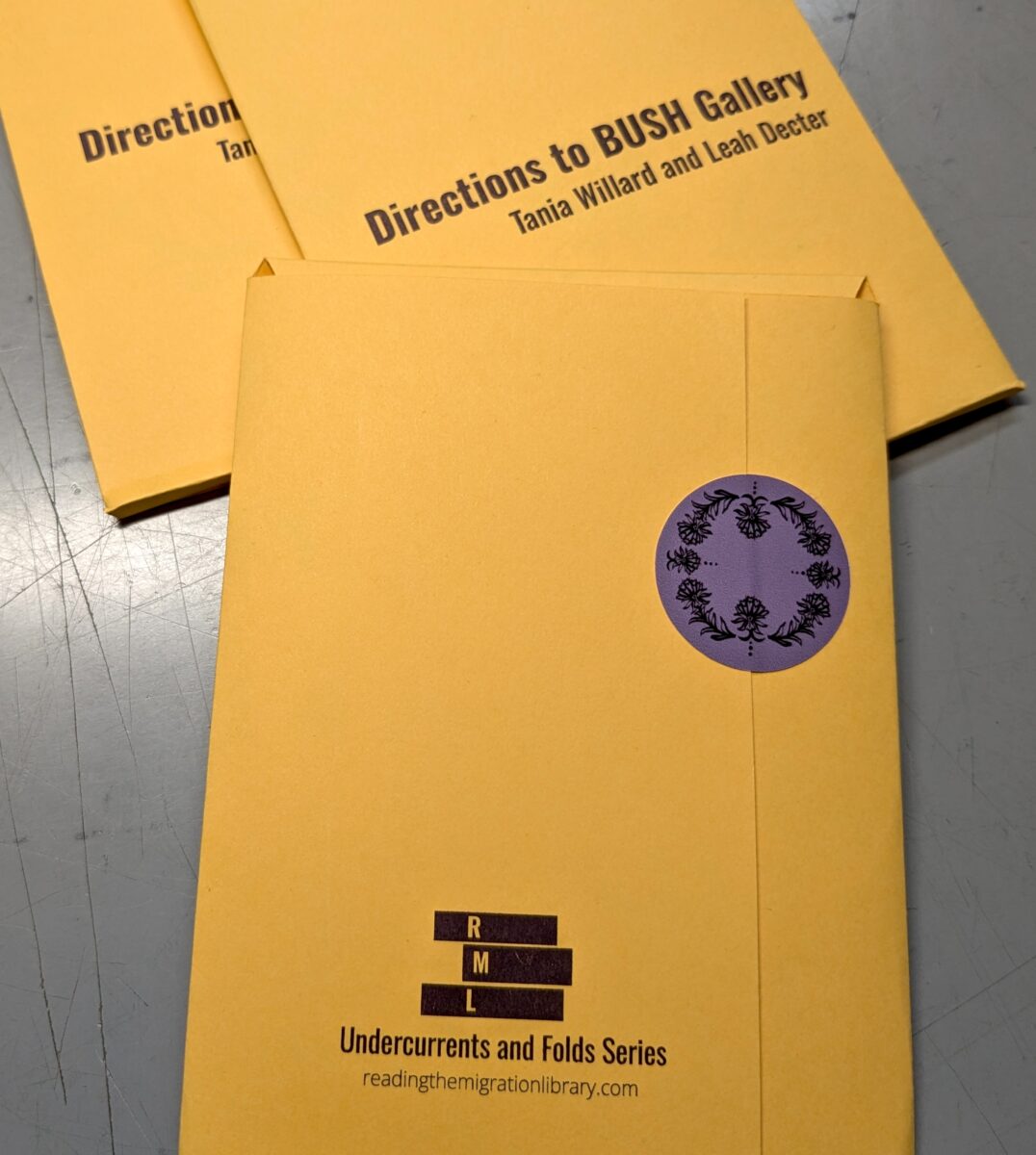 Photo of three components of the publication "Directions to BUSH Gallery" open and lying on a table.